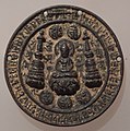 Bronze mirror in the Tibetan style, with the image of a Buddha and two stupas