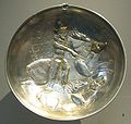 Gilded silver plate showing a king (identified as Shapur II ) hunting a deer whilst riding a stag