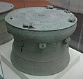 Bronze drum with frogs on surface and feathered man decoration