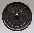 Han dynasty bronze mirror with kui and dragon images