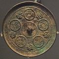 Bronze mirror with design of five "Dada Tongbao" coins