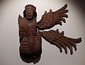 Carved wooden archangel, originally part of the decorated roof of St John's Chapel in St Mary's Church in Ewelme, Oxfordshire. The figure would originally have had four or six wings, and would have been painted. Circa 1450. AN1957.180.