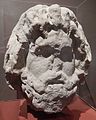 Stone head of Serapis, the Egyptian god of fertility and the afterlife. Recognised as a Roman statue in 1899 when it was in a garden in Silchester, Hampshire; it had previously been used as a cheese press on a local farm. It originally had a corn measure on its head. Reading Museum.